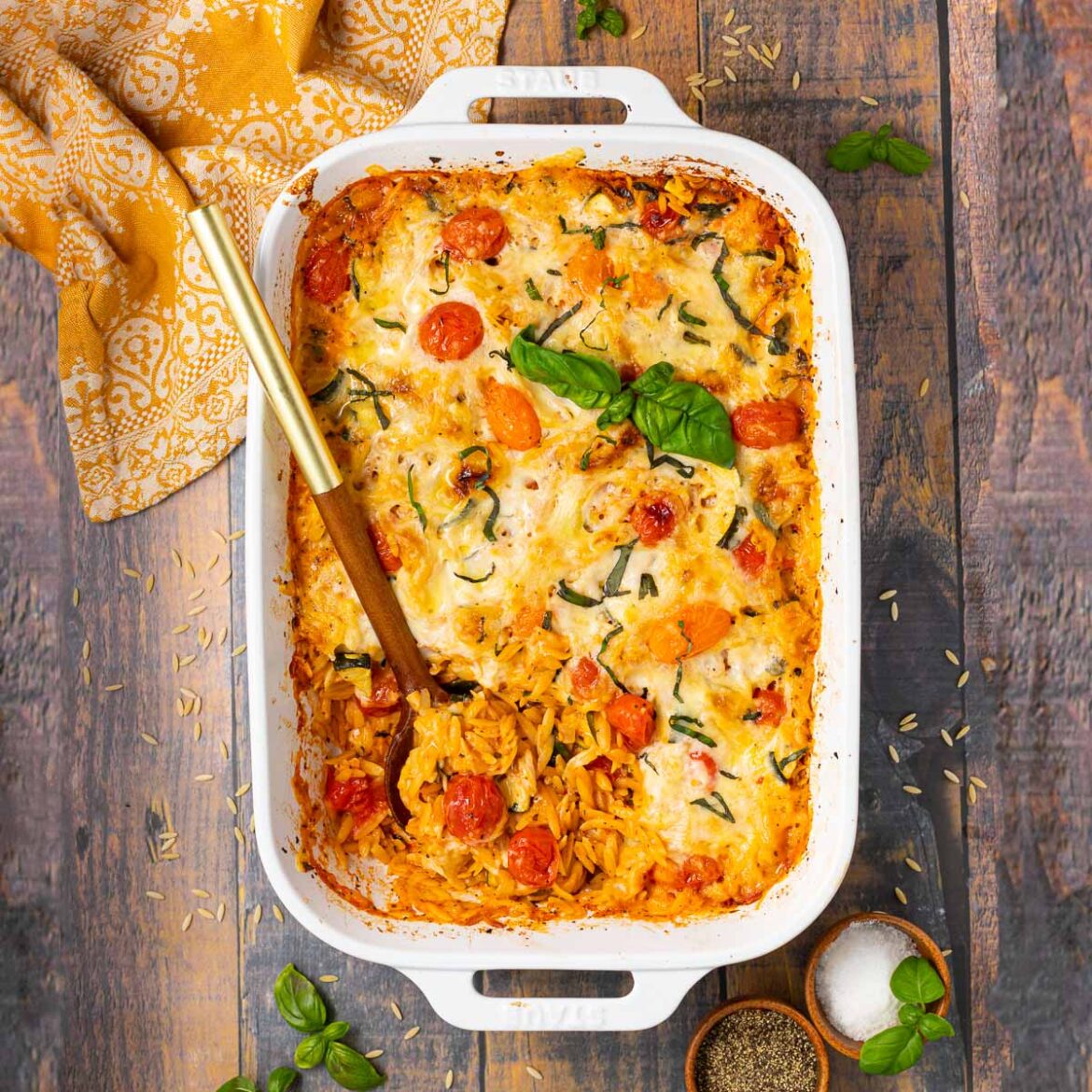 Baked-Vegan-Orzo-Recipe-A-Virtual-Vegan-7 Orzo Dump and Bake Vegetarian Recipe Preheat your oven to 375°F (190°C). Grease a baking dish with olive oil to prevent sticking. Step 2: Combine Ingredients In the baking dish, combine orzo, vegetable broth, diced tomatoes, spinach, mushrooms, zucchini, and garlic. Add oregano, basil, salt, and pepper. Stir well so all ingredients are evenly mixed. Step 3: Bake Cover the baking dish with aluminum foil and bake for 30 minutes. Remove the foil, give everything a quick stir, and sprinkle mozzarella and parmesan cheese on top (if desired). Return to the oven and bake uncovered for an additional 10 minutes, or until the cheese is melted and bubbly. Step 4: Serve Remove the dish from the oven and let it cool for a few minutes. Serve hot and enjoy your creamy vegetarian orzo bake!